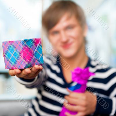 Portrait of young man inside shopping mall standing relaxed and 