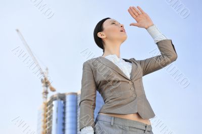 Portrait of a beautiful young businesswoman outside.