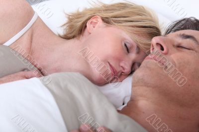 Husband and wife sleeping