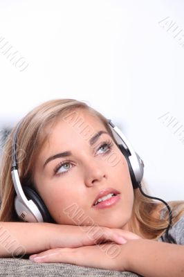Girl listening to music on headphones Girl listening to music on headphones