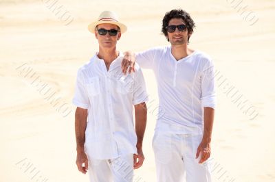 Father and son stood on beach Father and son stood on beach