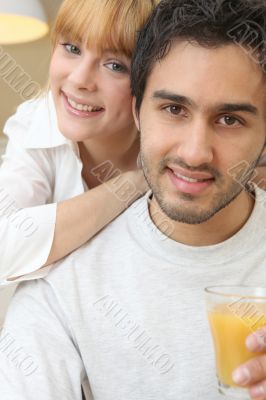 Couple with a glass of orange juice Couple with a glass of orange juice