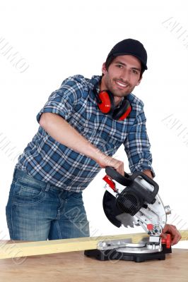 A carpenter with a circular saw.