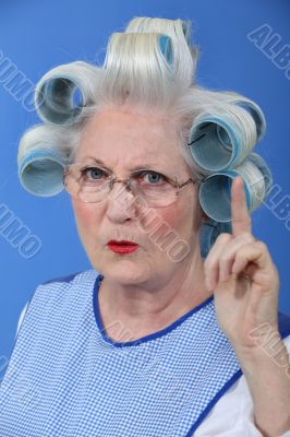 Old woman waving her finger in disapproval