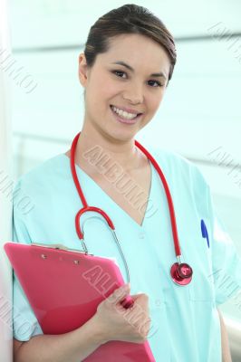 Female medic with a clipboard