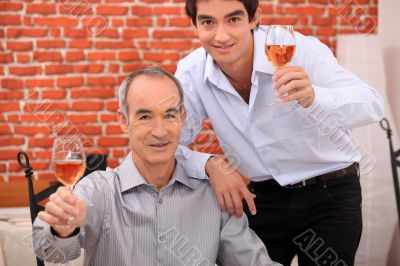 Men raising their glasses in a toast