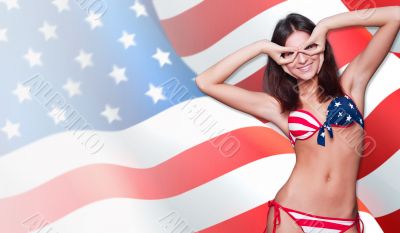 20-25 years old beautiful woman in swimsuit with american flag a