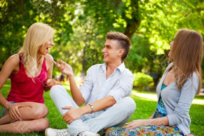 Portrait of three young teenagers laughing and having fun togeth