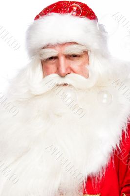 Santa Claus portrait smiling isolated over a white background an