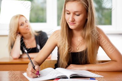 Portrait of a young group of students paying attention in class.