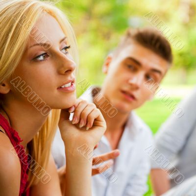 Portrait of three young teenagers laughing and having fun togeth