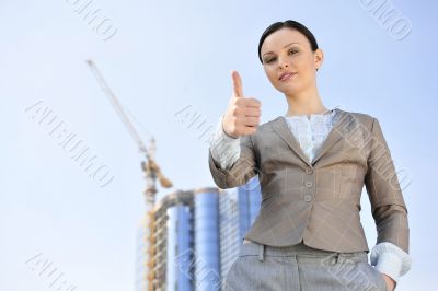 Portrait of a beautiful young businesswoman celebrating.