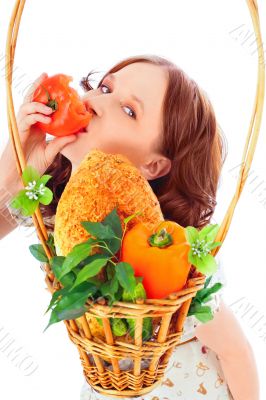 Closeup portrait of young pretty woman with basket of autumn har