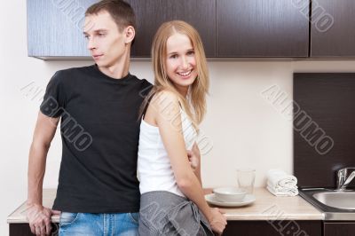Portrait of a cute young couple enjoying themselves while prepar