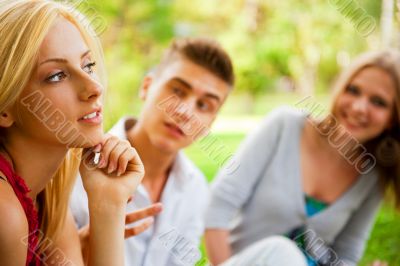 Portrait of three young teenagers laughing and having fun togeth