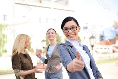 Business woman in a friendly environment of her colleagues 