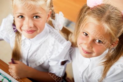 Little girls drawing pictures and writing letters to Santa Claus