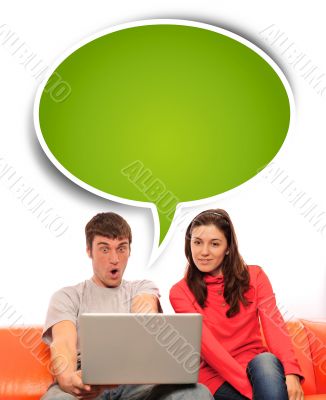 Portrait of a young couple using a computer.