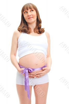 Image of pregnant woman touching her belly with hands