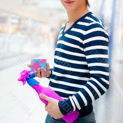 Portrait of young man inside shopping mall st