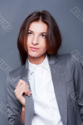 Portrait of a beautiful young business woman standing with hand 