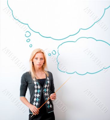 Portrait of young teacher pointing on white marker board in mode