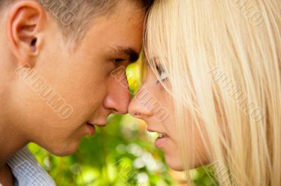 Closeup portrait of smiling young couple in love - Outdoors