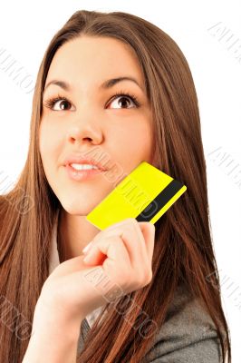 Happy blond woman showing blank credit card