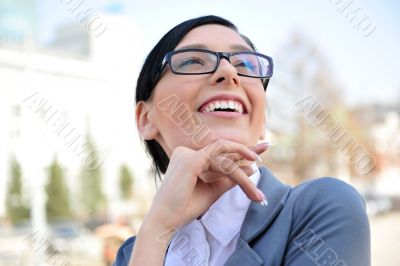 Closeup portrait of cute young business woman smiling