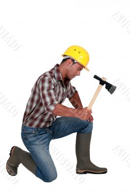 Tradesman using an axe