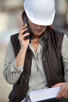 Female foreman with radio receiver