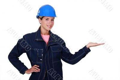 Manual worker holding out her hand in empty copyspace Manual worker holding out her hand in empty copyspace