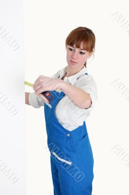 Female worker with a tape measure