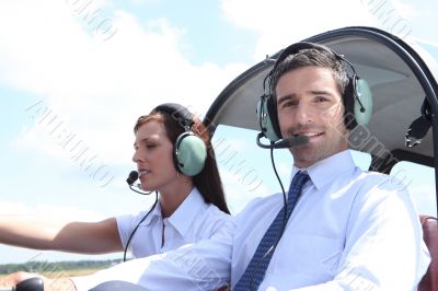 Man and woman in the cockpit of a light aircraft