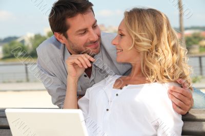 happy couple relaxing outdoors