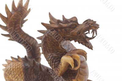 Wooden dragon, symbol of chinese new year, isolated on white background 