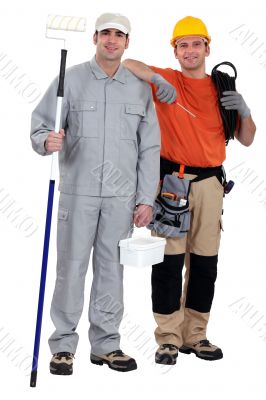 Painter and electrician standing on white background