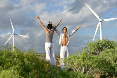 Couple stood in wind farm