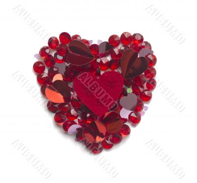 Heart shape made with confetti and crystals,  isolated on white