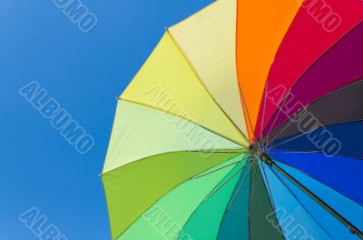 Colorful umbrella on a sky background