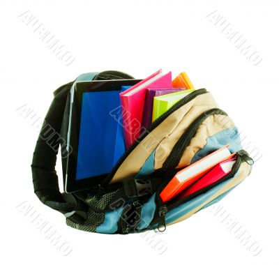 Backpack with colorful books and tablet PC against white backgro