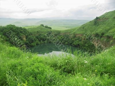 Small lake between the caucasus mountains summertime Small lake between the caucasus mountains summertime