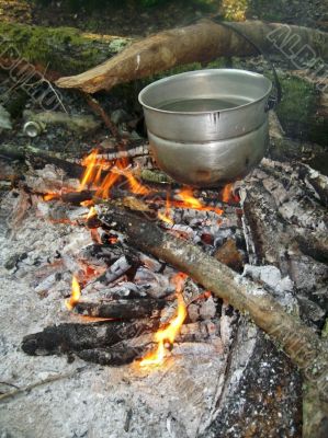 Water for tea boiling on the bonfire Water for tea boiling on the bonfire