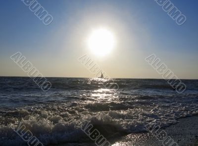 Lonely sail drifting under the big sun Lonely sail drifting under the big sun