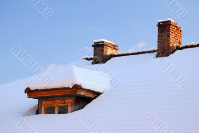 Attic Window and Two Chimneys in Winter