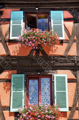 Flowers and windows in the city of Colmar France