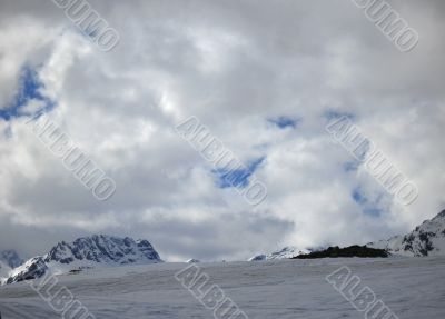 Dombay mountains wintertime. Empty track for ski.