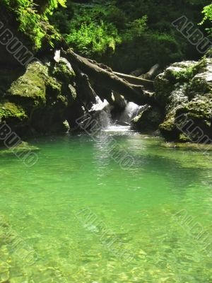 Waterfall between the rocks. The Caucasus nature