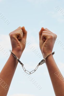 Handcuffed woman`s hands