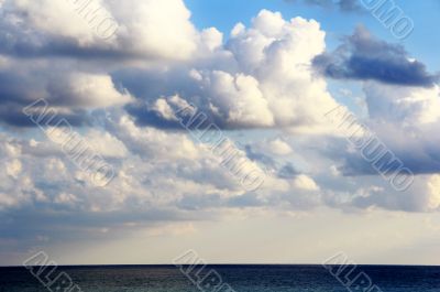 Scenery with sea and fluffy sky